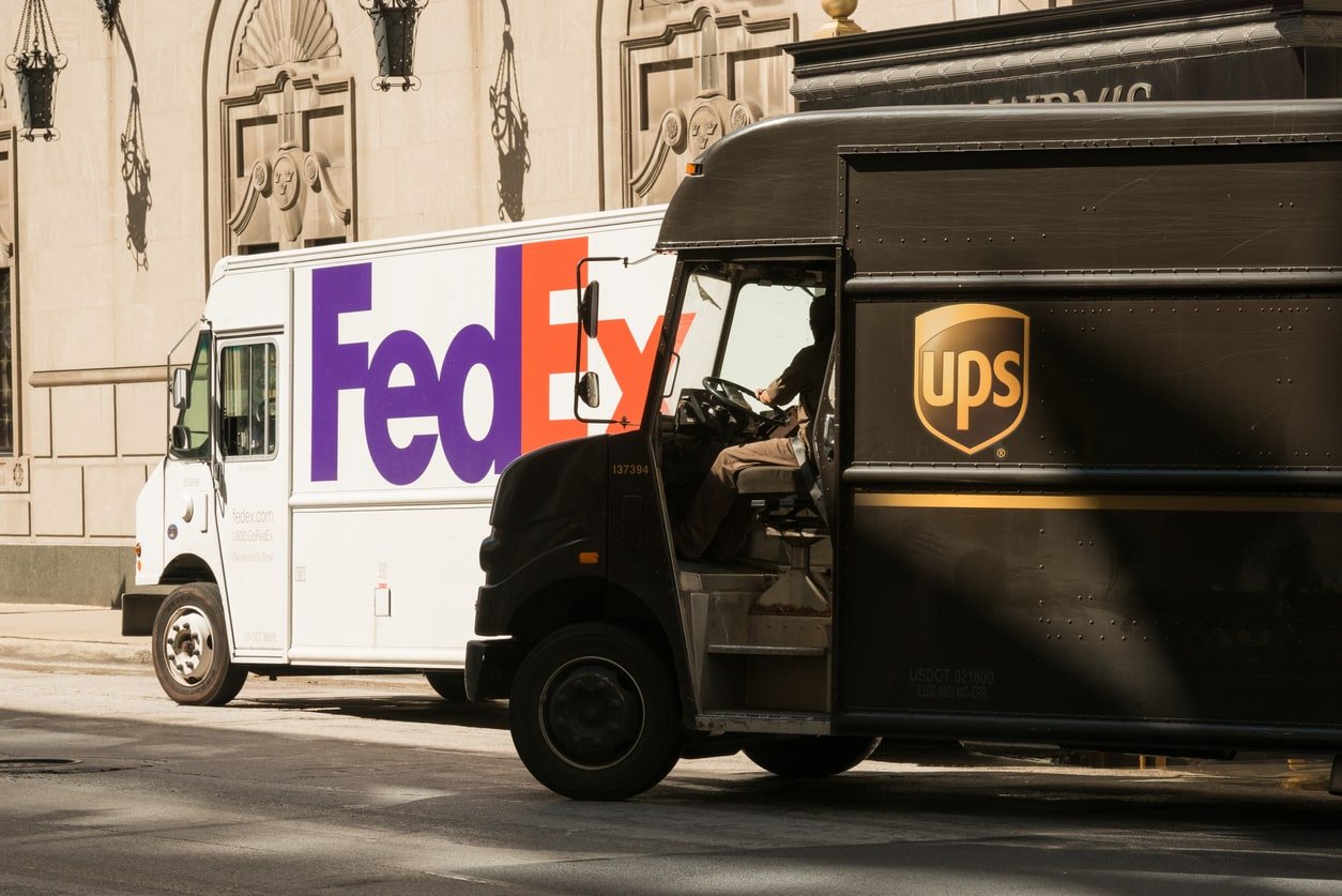 fedex and ups trucks on michigan avenue, the loop, chicago